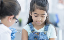 Little girl getting a needle